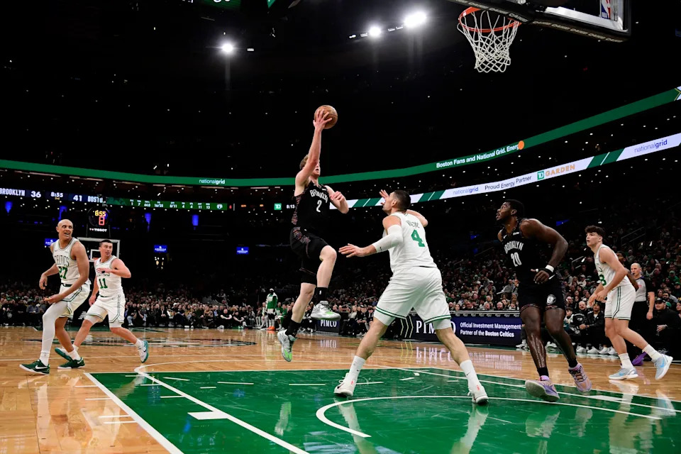 Feb 27, 2026; Boston, Massachusetts, USA; Brooklyn Nets forward Danny Wolf (2) drives to the basket while Boston Celtics center Nikola Vucevic (4) defends during the first half at TD Garden. Mandatory Credit: Bob DeChiara-Imagn Images