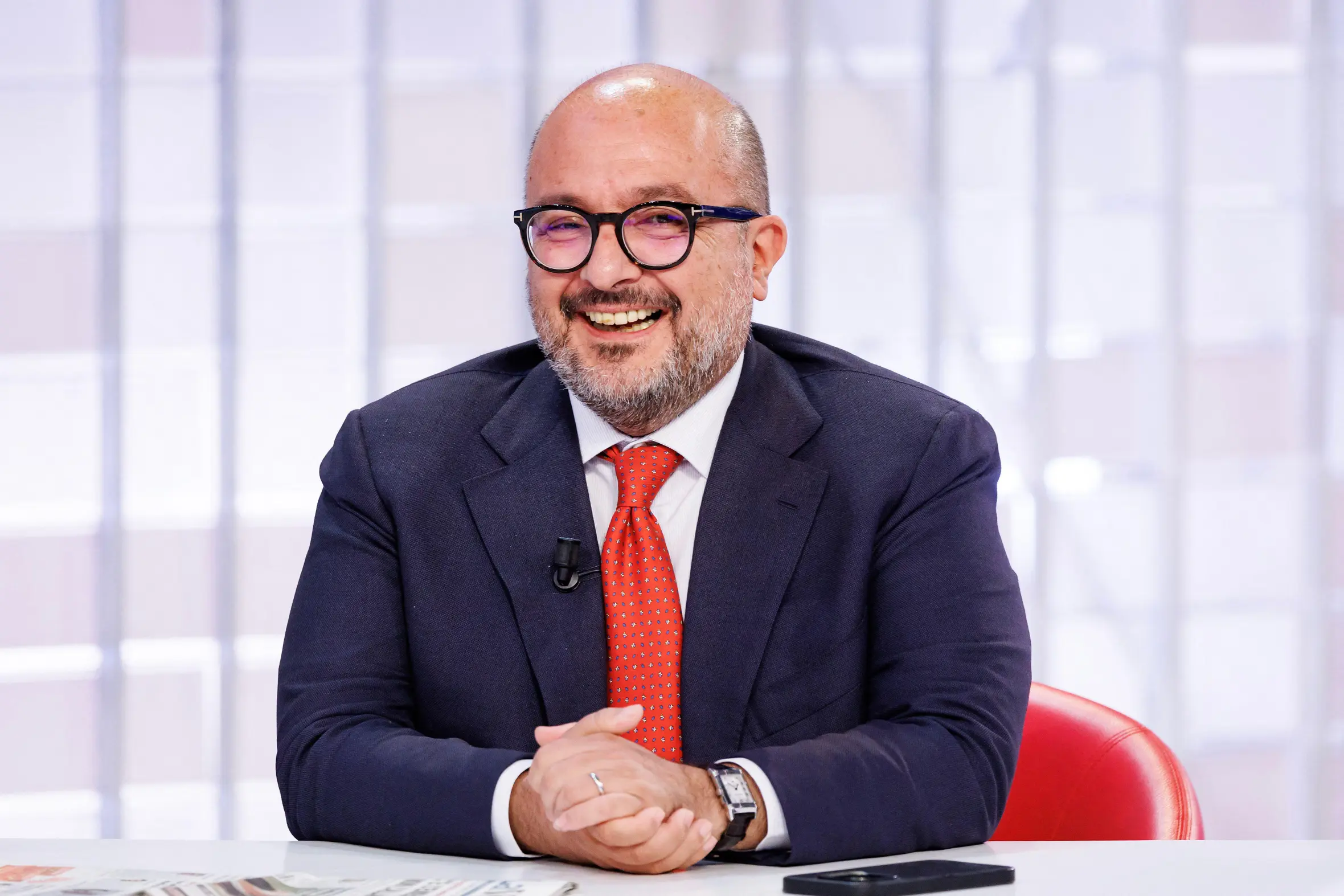 Gennaro Sangiuliano smiling while on the TV program "L'Aria che Tira"