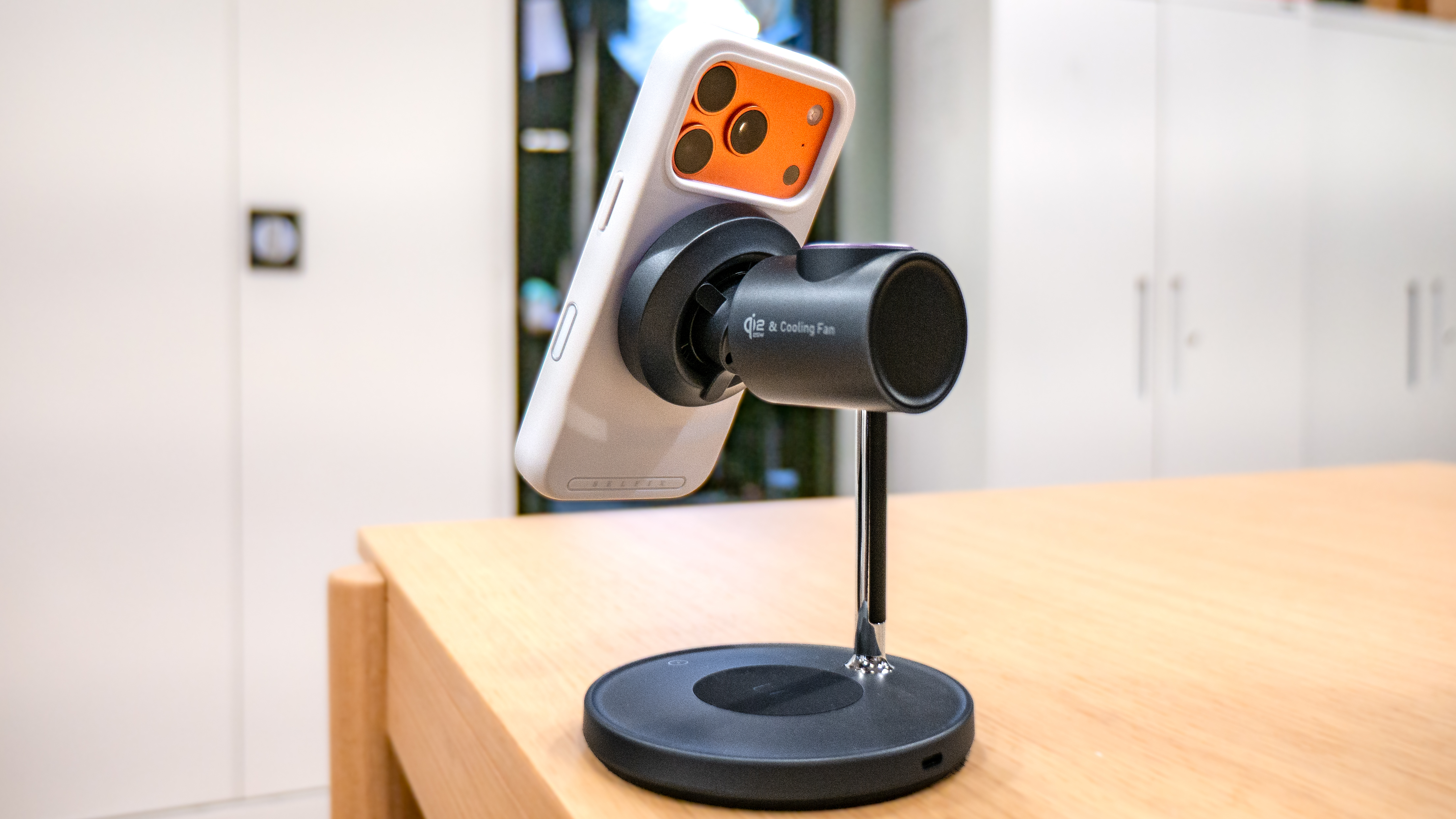 LISEN 3-in-1 Qi2.2 MagSafe Charging Stand with Cooling Fan with an iPhone connected to it.