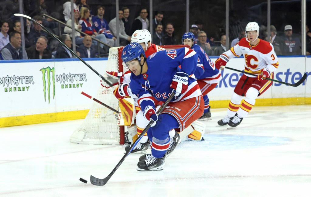 Rangers center Noah Laba #42 moves the puck down ice during the first period.