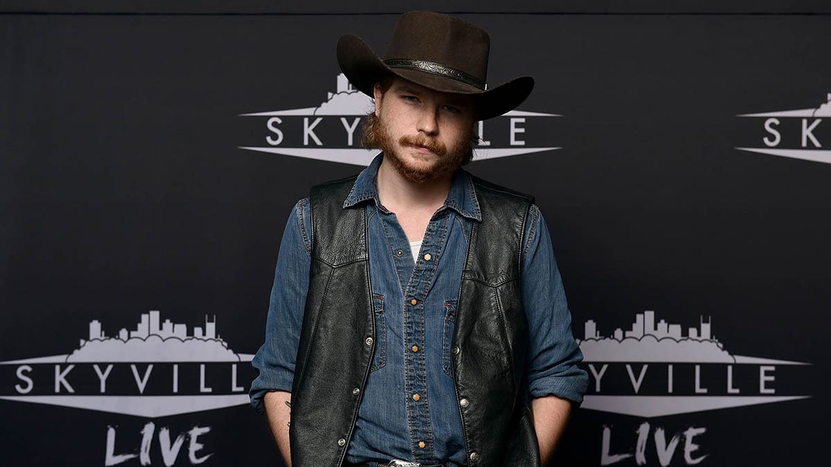 Colter Wall poses on the red carpet at the Skyville Live event in Nashville, Tennessee.