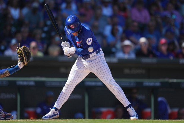 Chicago Cubs' Matt Shaw gets hit by a pitch against the Kansas City Royals during the second inning of a spring training baseball game Wednesday, March 11, 2026, in Mesa, Ariz. (AP Photo/Ross D. Franklin)