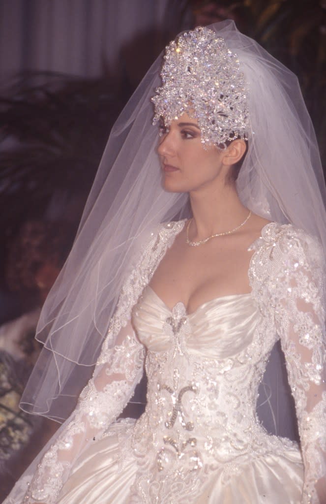 Celine Dion, who wed in 1994, topped her intricate wedding gown with a tiara covered in 2,000 Swarovski crystals. It was so heavy that it famously sent her to the hospital. Gamma-Rapho via Getty Images