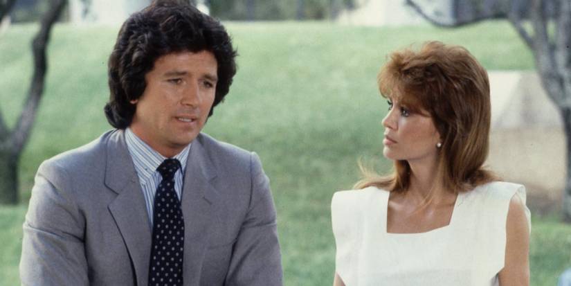 Victoria Principal and Patrick Duffy in Dallas standing outside looking serious