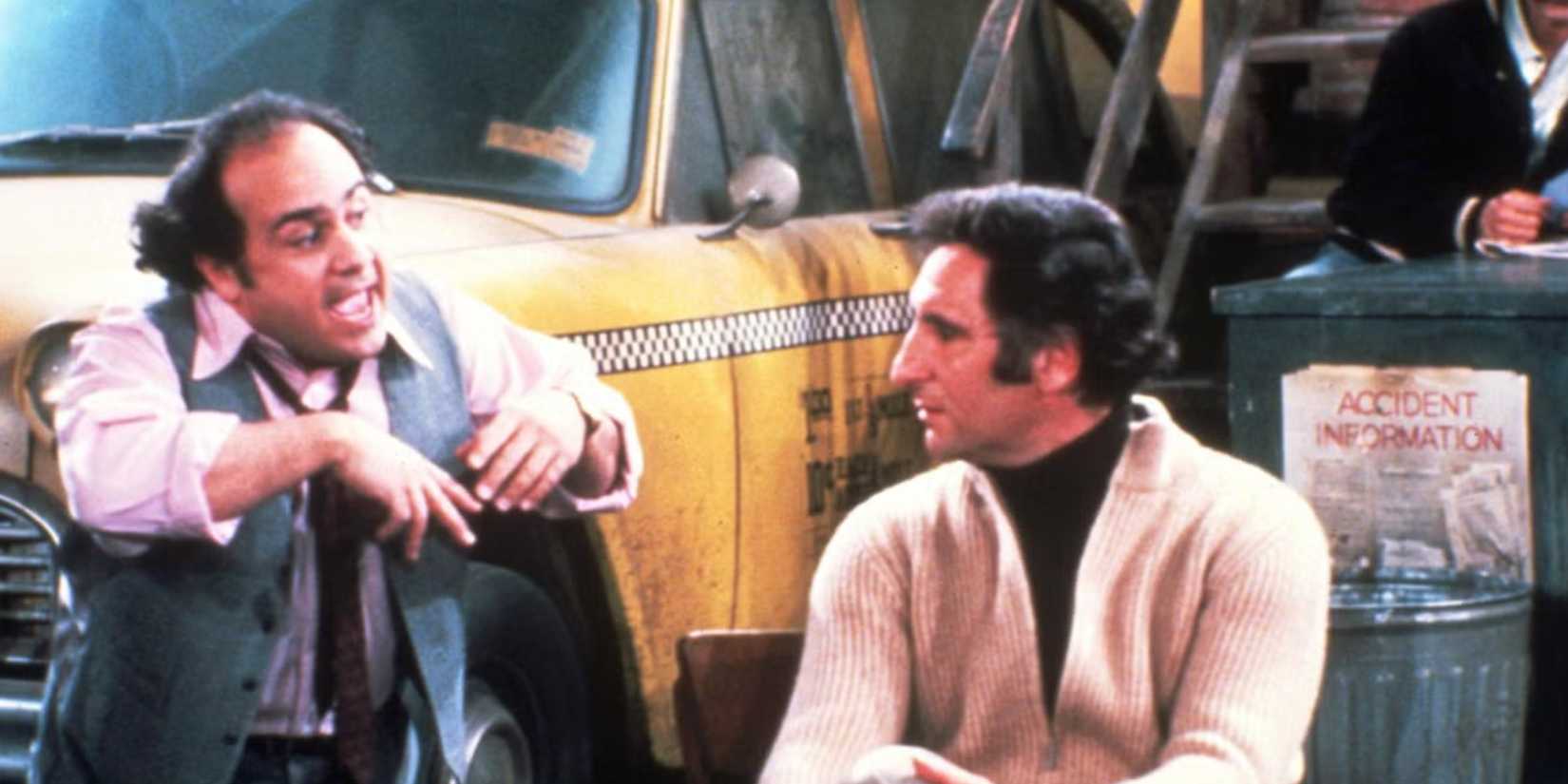 Danny DeVito as Louie and Judd Hirsch as Alex having a heated conversation at the dispatch centre in Taxi.