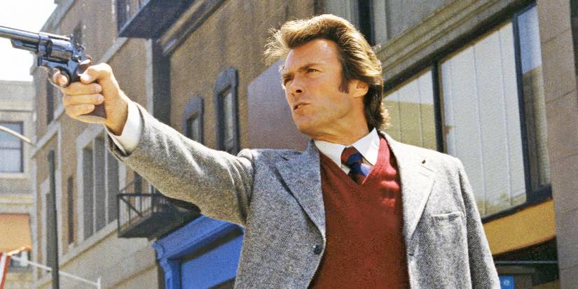 Clint Eastwood aims a weapon in the San Francisco street as Dirty Harry