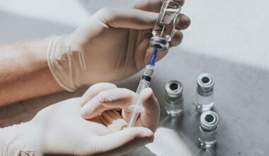 A healthcare professional preparing a shingles vaccine.