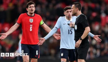 Harry Maguire of England and Federico Valverde of Uruguay react towards referee Sven Jablonski