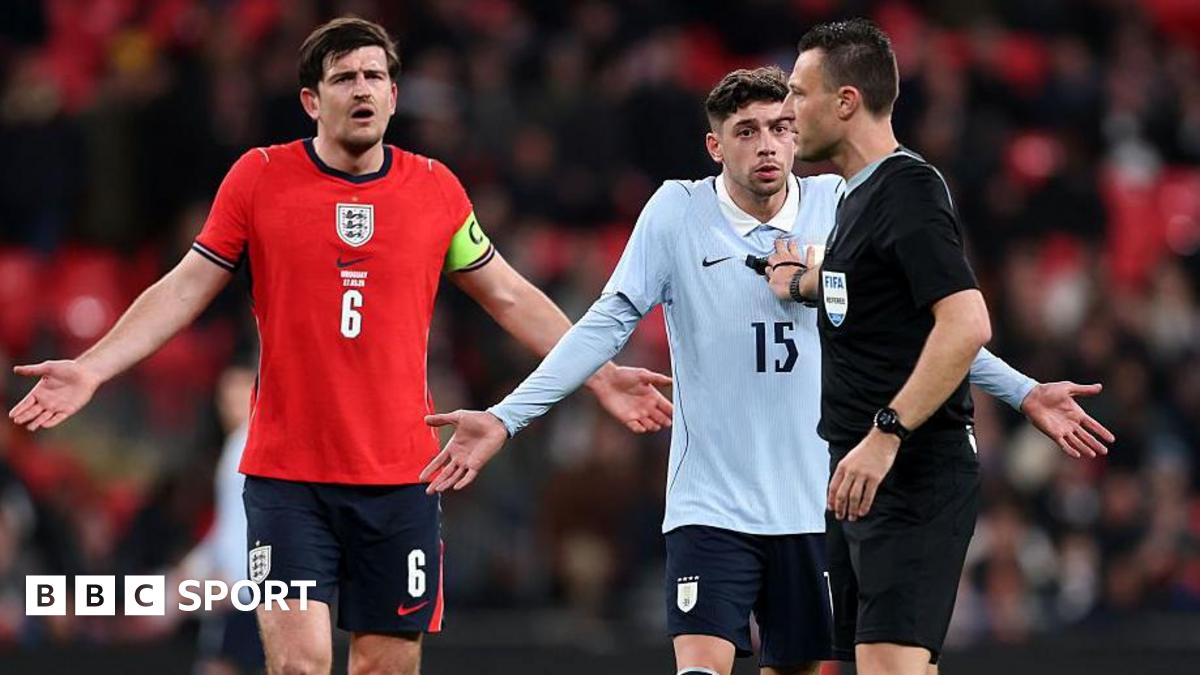 Harry Maguire of England and Federico Valverde of Uruguay react towards referee Sven Jablonski