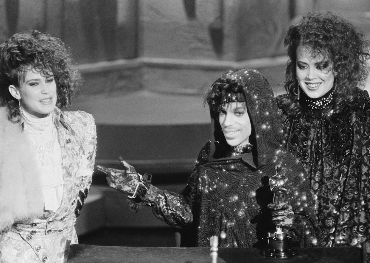 Prince and members of his group accept their Oscar for Best Original Song Score for  - 