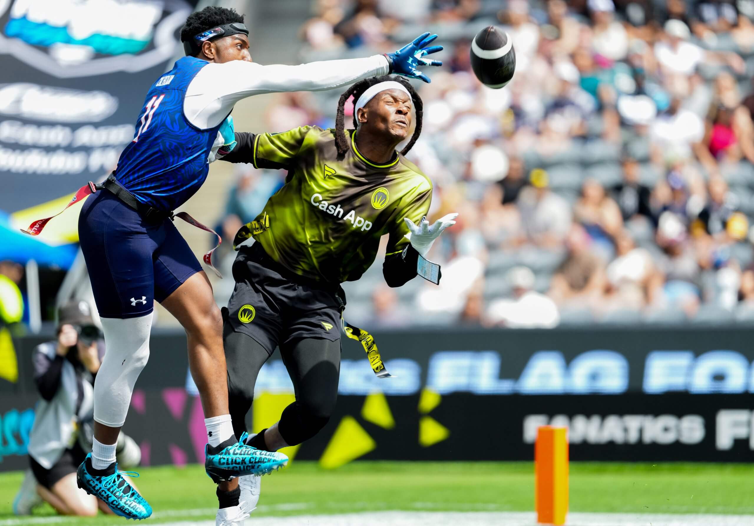 Isaiah Calhoun #11 of the US Men's Flag Football Team defends DeAndre Hopkins #10 of the Wildcats FFC during the Fanatics Flag Football Classic at BMO Stadium on March 21, 2026 in Los Angeles, California.