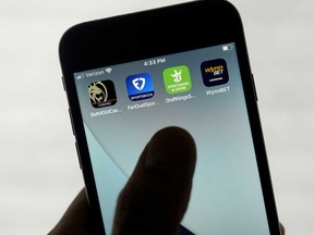 FanDuel, DraftKings and other online gambling apps are displayed on a phone in San Francisco, Sept. 26, 2022.