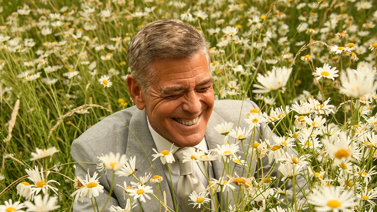 George Clooney in a field of flowers