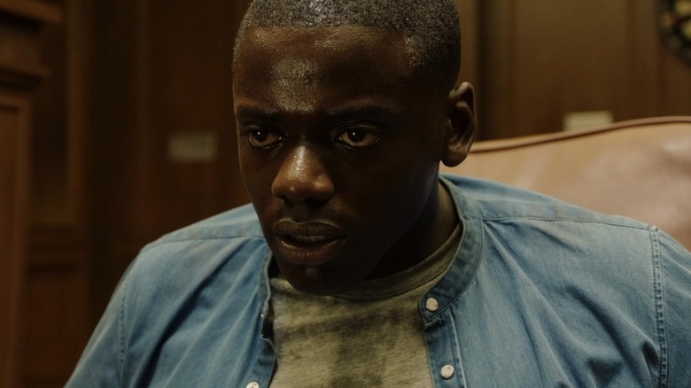 Daniel Kaluuya as Chris looking sweaty and scared in Get Out