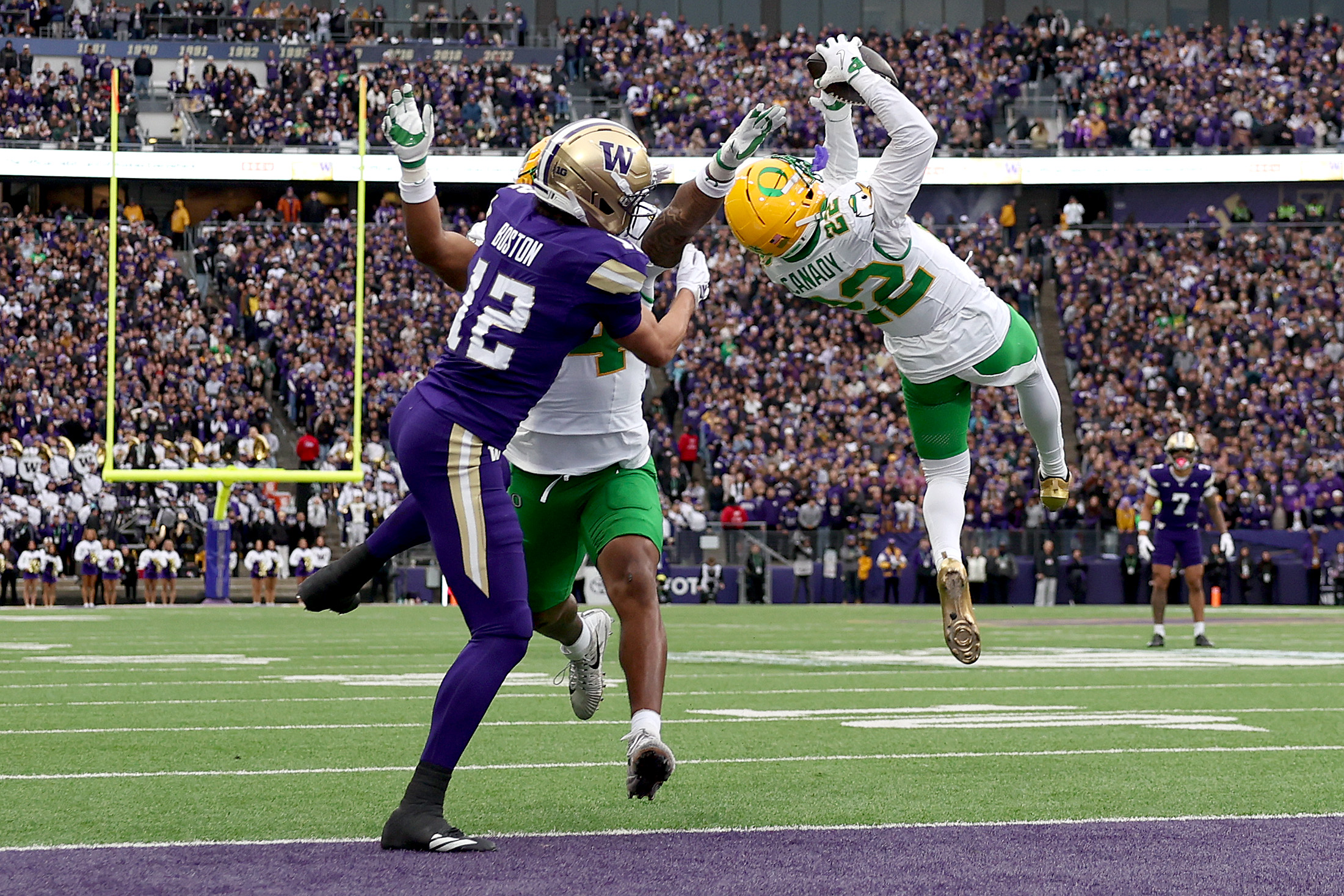 SEATTLE, WASHINGTON - NOVEMBER 29: Jadon Canady #22 of the Oregon Ducks intercepts a pass against Denzel Boston #12 of the Washington Huskies during the first half at Husky Stadium on November 29, 2025 in Seattle, Washington. (Photo by Steph Chambers/Getty Images)