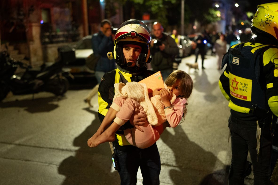 Emergency workers assist civilians after a strike in Tel Aviv, Israel, on February 28.