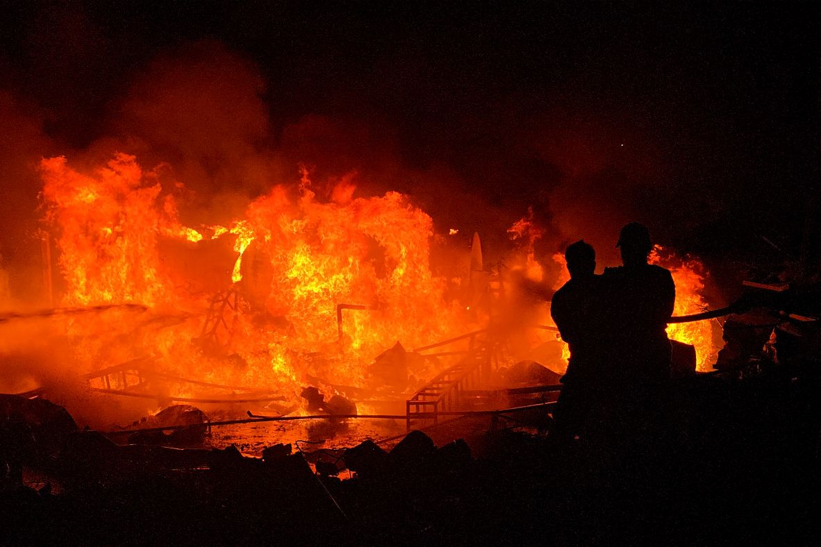 Civil defense forces in Tyre, Lebanon, try to extinguish a blaze after Israel bombarded a solar farm and electricity generation facility. Israeli strikes have pummeled parts of Lebanon this week after the Iranian-backed militant group Hezbollah claimed responsibility for firing projectiles from Lebanon into Israel on Monday.