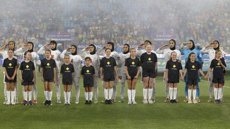 Iranian women’s soccer team forced to sing national anthem ahead of Asian Cup match, sources tell CNN
