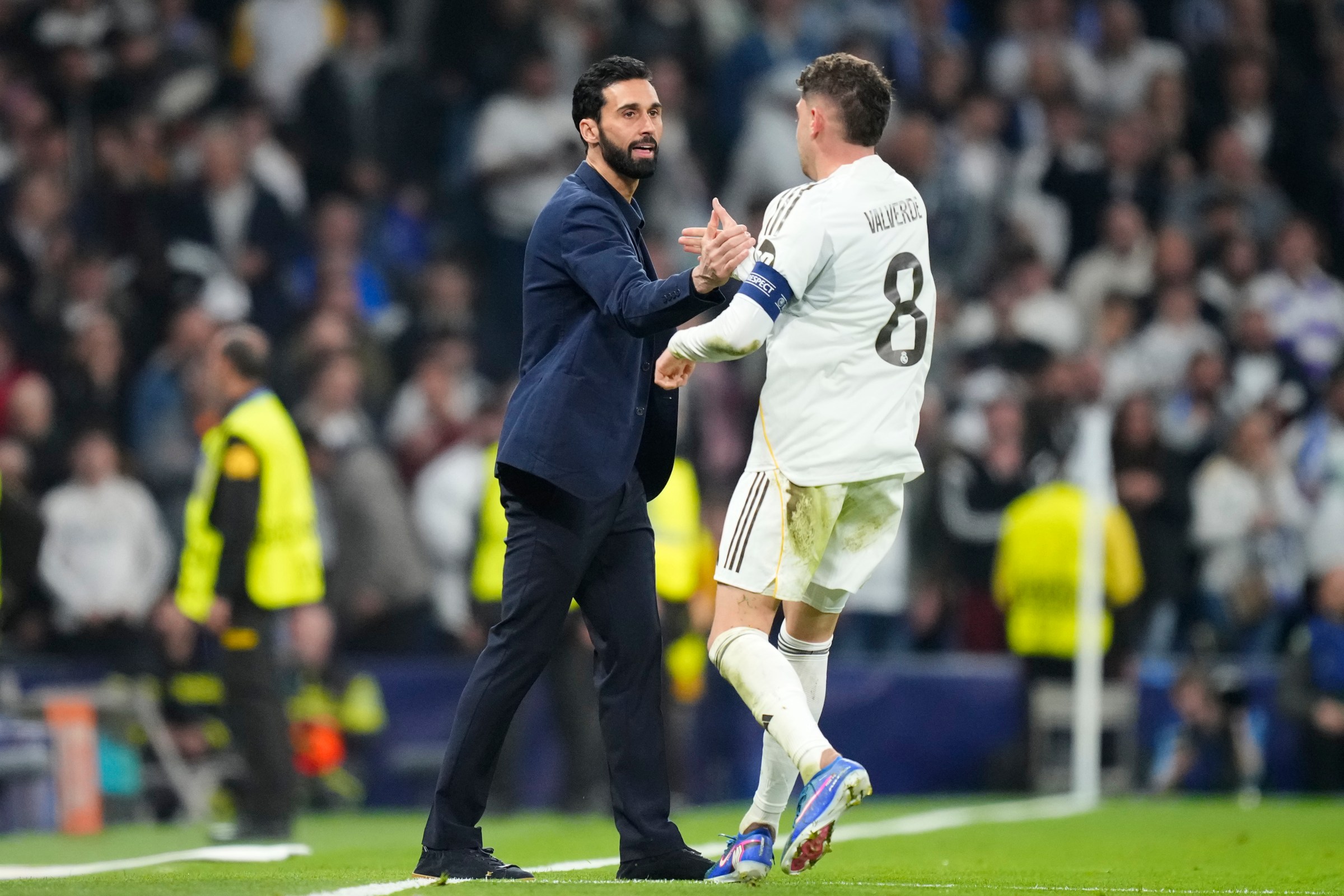 Federico Valverde central midfield of Real Madrid and Uruguay celebrates with Alvaro Arbeloa head coach of Real Madrid after scoring his sides first goal during the UEFA Champions League 2025/26 Round of 16 First Leg match between Real Madrid CF and Manchester City FC at Estadio Santiago Bernabeu on March 11, 2026 in Madrid, Spain. (Photo by Jose Breton/Pics Action/NurPhoto via Getty Images)