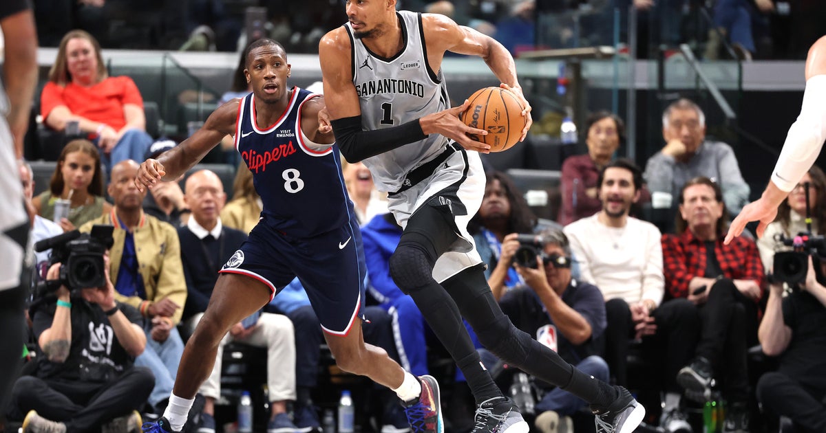Wembanyama powers Spurs past Clippers 119-115 after wild swings and a late scare to reach 50 wins