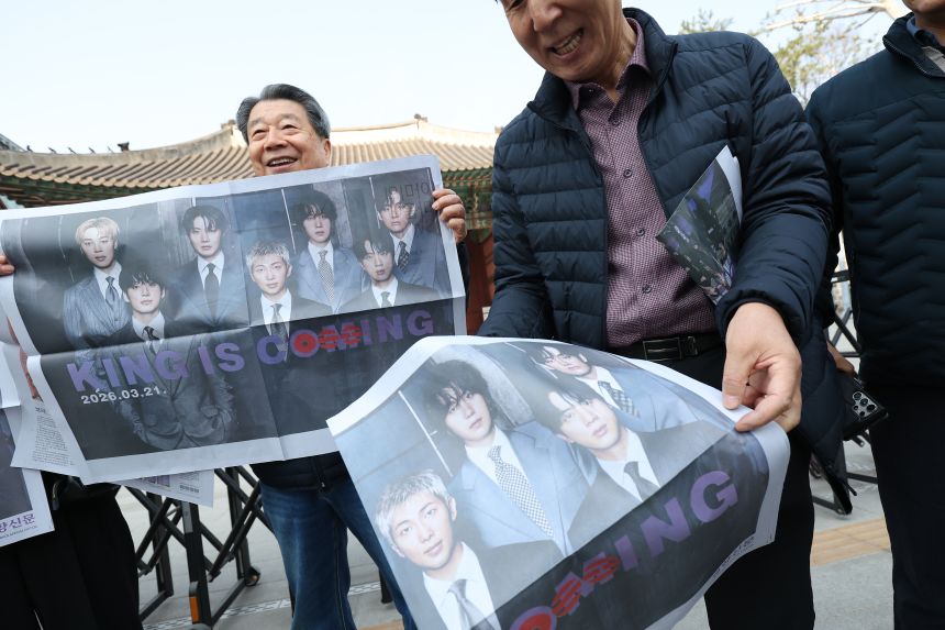 People received special-edition newspapers on BTS' comeback near Gwanghwamun Square.