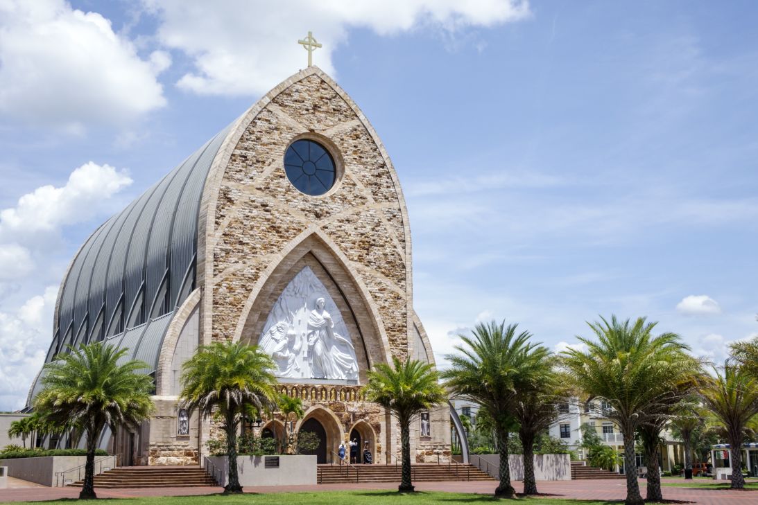 A massive Catholic church dominates the main square of the town, ringed by shops and restaurants, and it directly faces the Ave Maria University campus.