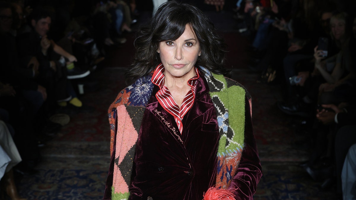 Gina Gershon on the runway.