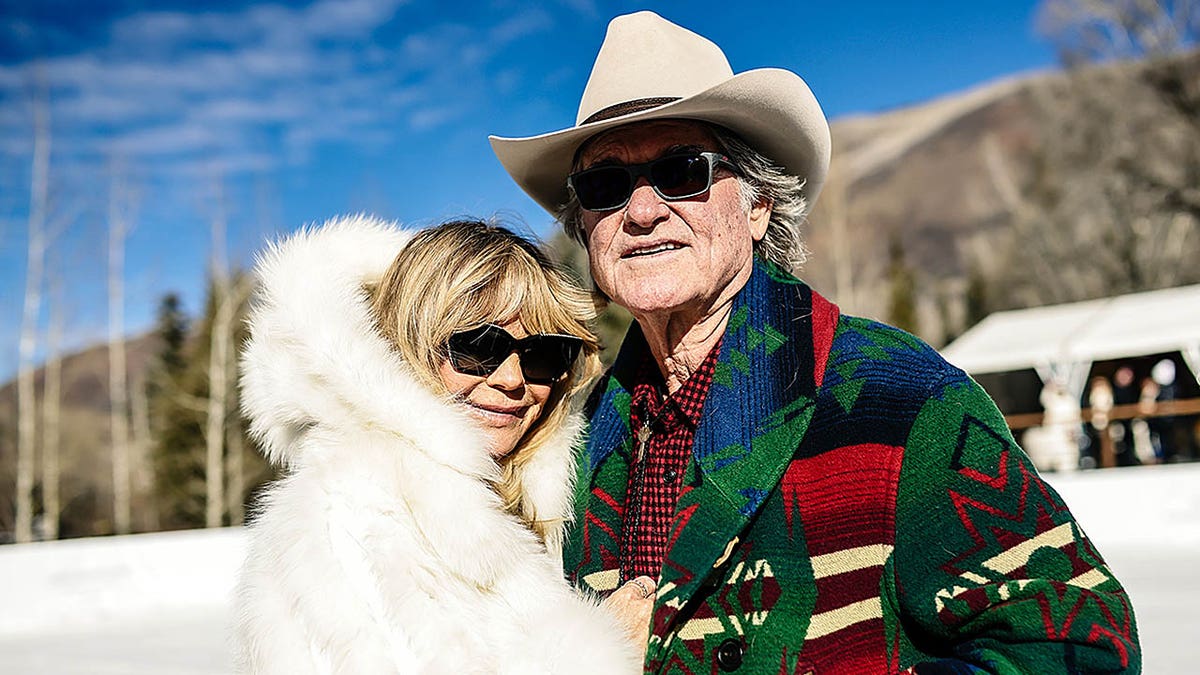 Goldie Hawn and Kurt Russell pose for a photo together outside in Aspen, Colorado