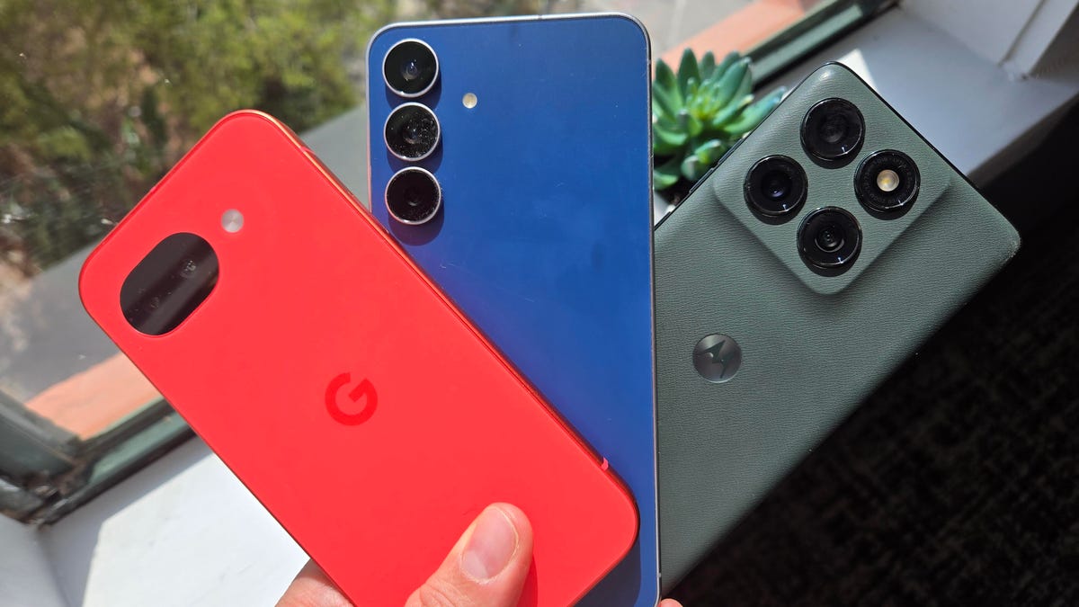 A red Google's Pixel 10A, blue Samsung Galaxy S25 FE and green Motorola Edge.