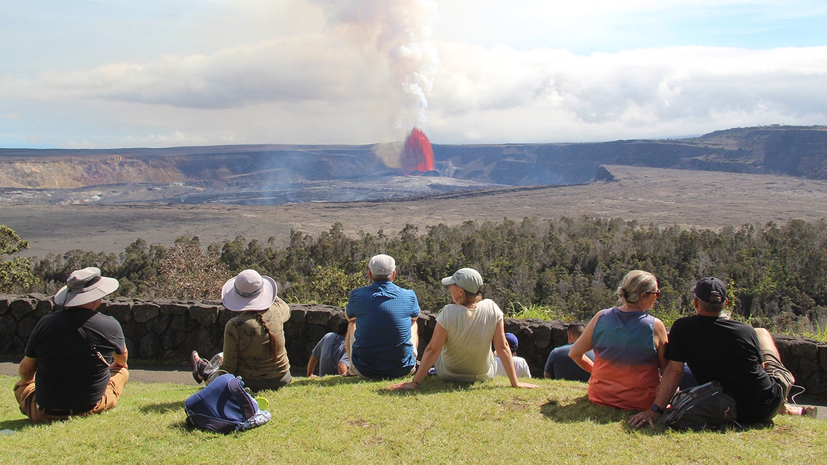 Tourists looking at volcanos in Hawaii