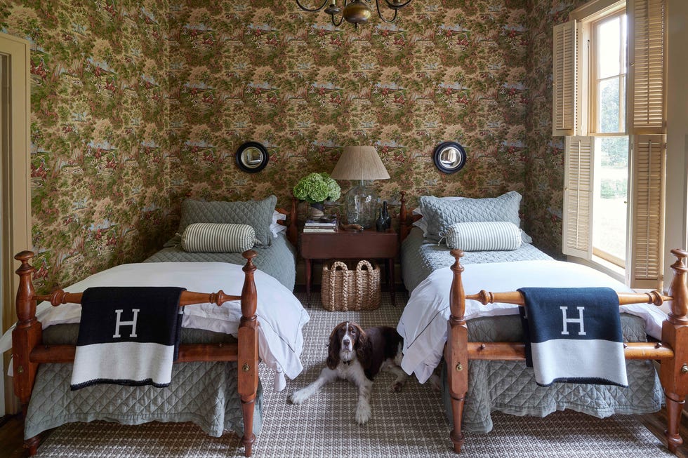 house tour chadduck montrose arkansas guest bedroom twin beds belgian flax linen quilts cover a pair of twin beds that both sam and his father slept in as children and the small convex mirrors are by oka and the check rug is by fibreworks