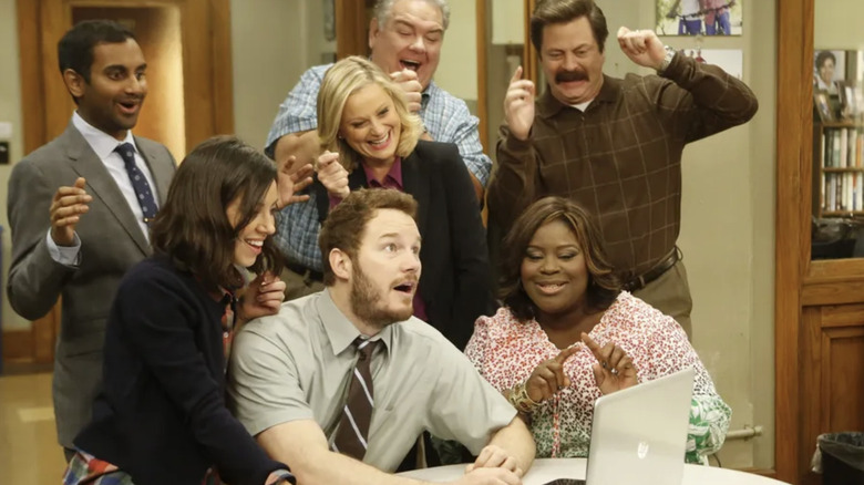The Parks and Rec crew celebrate in the office on Parks and Recreation (2009-2015)