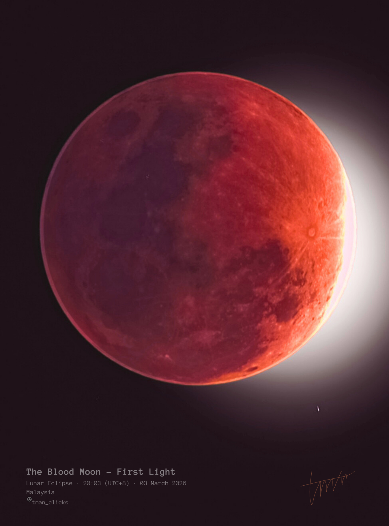 A red full moon is pictured during a total lunar eclipse against a black sky.