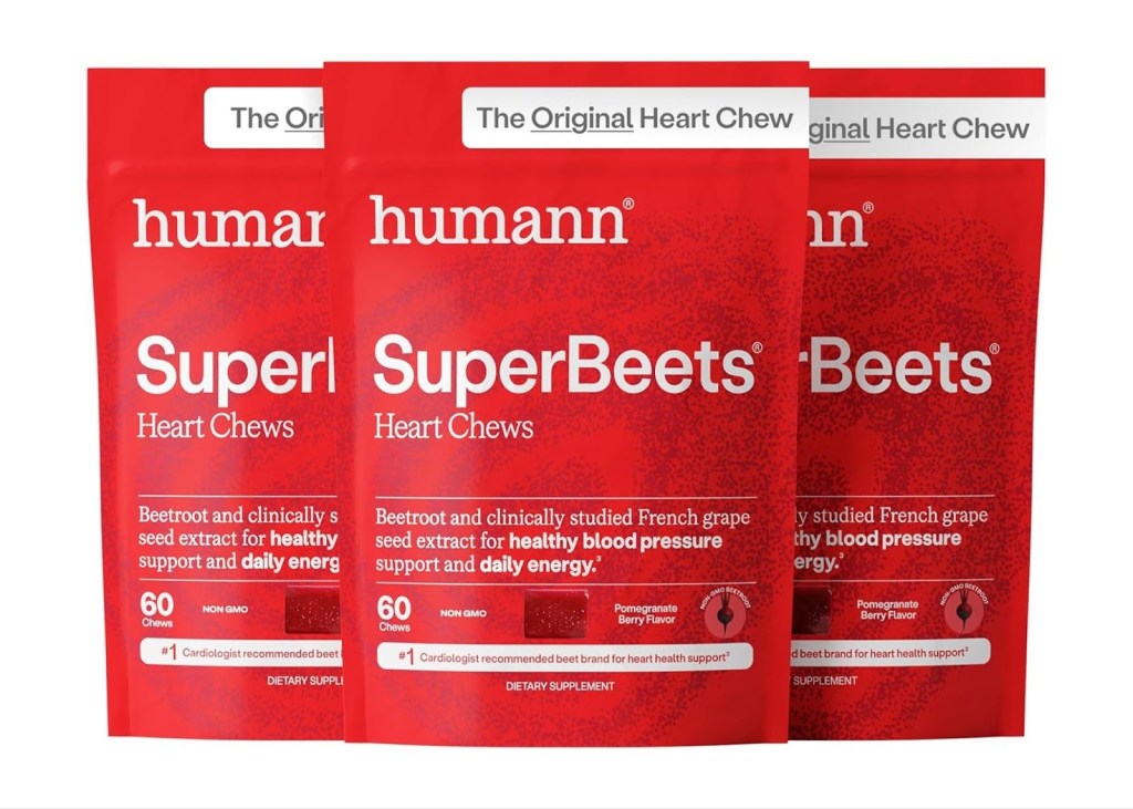 Three red pouches of Humann SuperBeets Heart Chews dietary supplement, pomegranate berry flavor.
