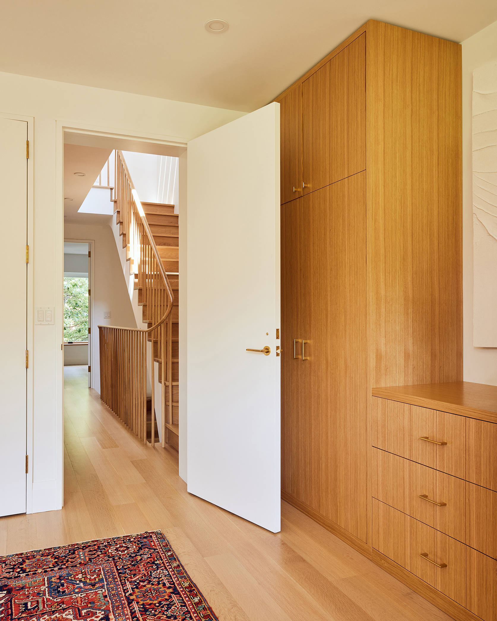 BEDROOM WITH OPEN DOOR BUILT INS