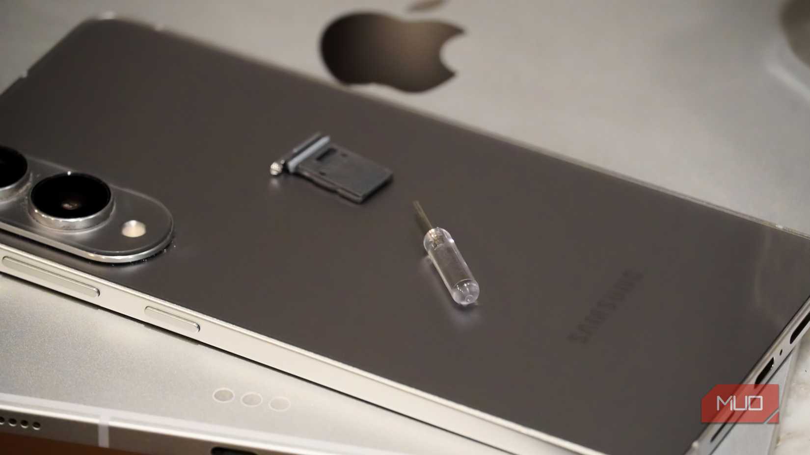 The SIM card tray and tool on an Android phone and iPad.