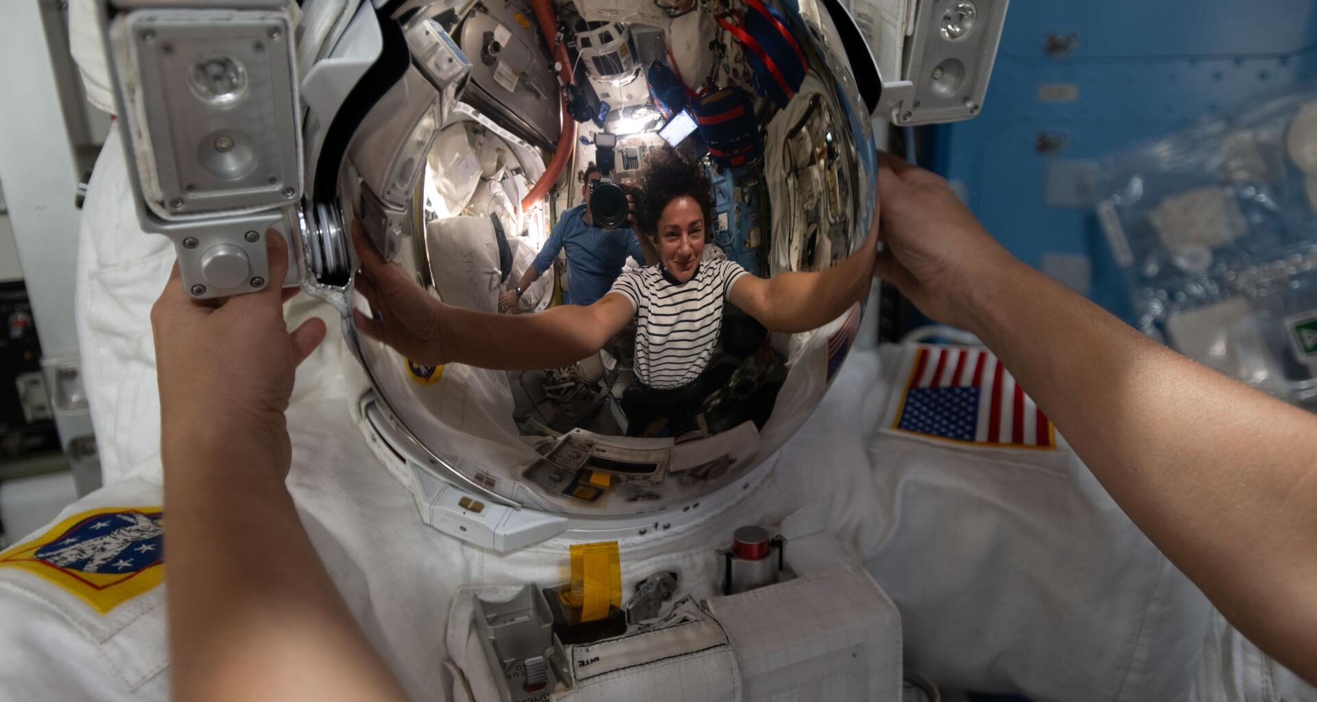 NASA astronaut and Expedition 74 flight engineer Jessica Meir’s reflection is captured in a spacesuit helmet visor. The visor assembly is coated with a microscopic layer of gold that reflects infrared radiation to protect an astronaut’s eyes while allowing visible light to pass through. Meir was working inside the International Space Station's Quest airlock, installing leg and arm components on the spacesuit and swapping components from one suit to another.