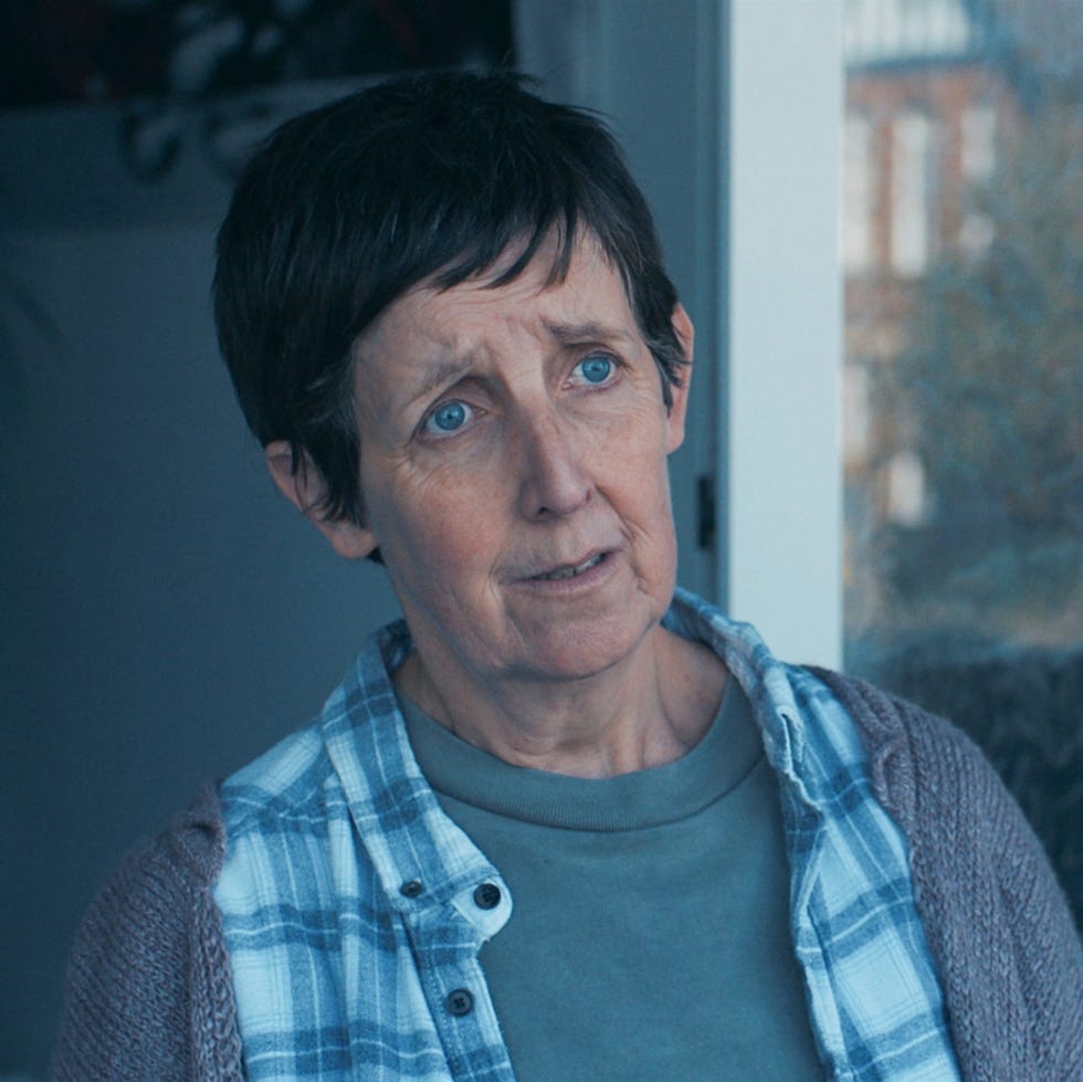 a person in a cozy indoor setting partially obscured