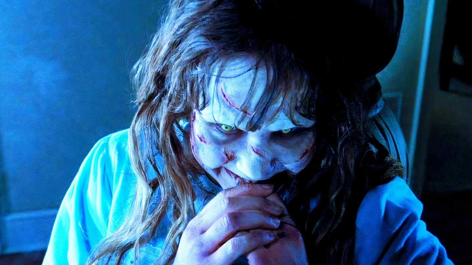 Linda Blair as Regan laughing in The Exorcist