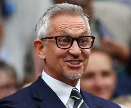 Former footballer and TV presenter Gary Lineker looking happy at Wimbledon in the royal box on centre court