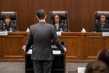 Students arguing in front of Justice Ketanji Brown Jackson