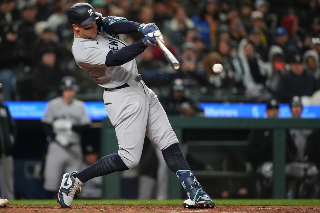 Aaron Judge hits a single against the Seattle Mariners during the eighth inning of a baseball game, Monday, March 30, 2026.