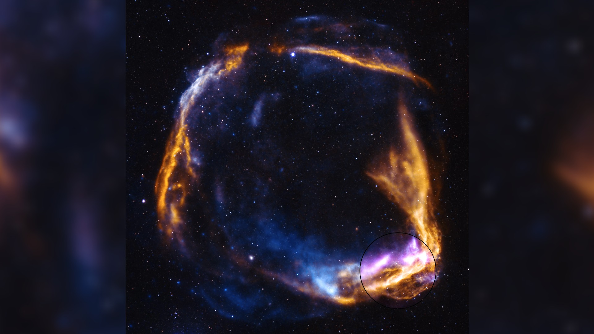 a colorful ring of wispy gas on a starry background