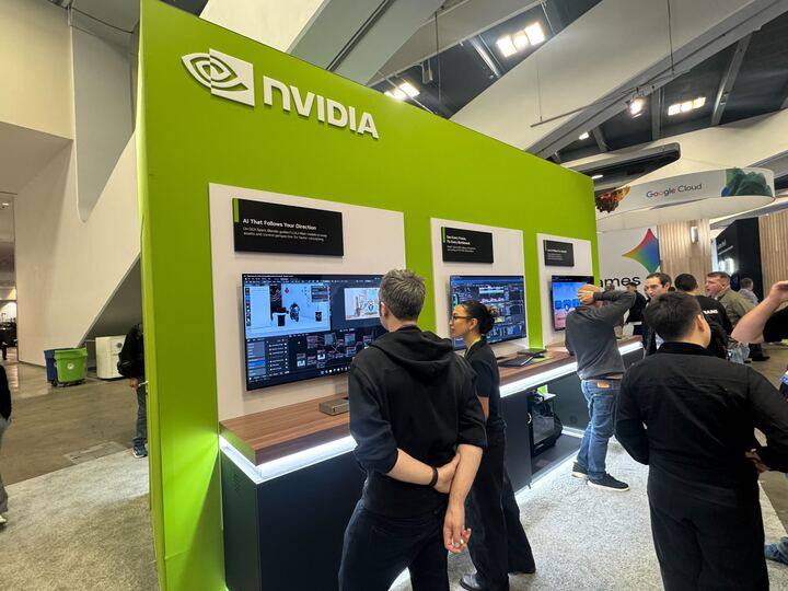People stand around an Nvidia booth at GDC.