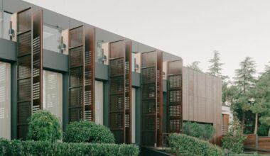 punctured iron doors shape kinetic facade by TIMM architecture