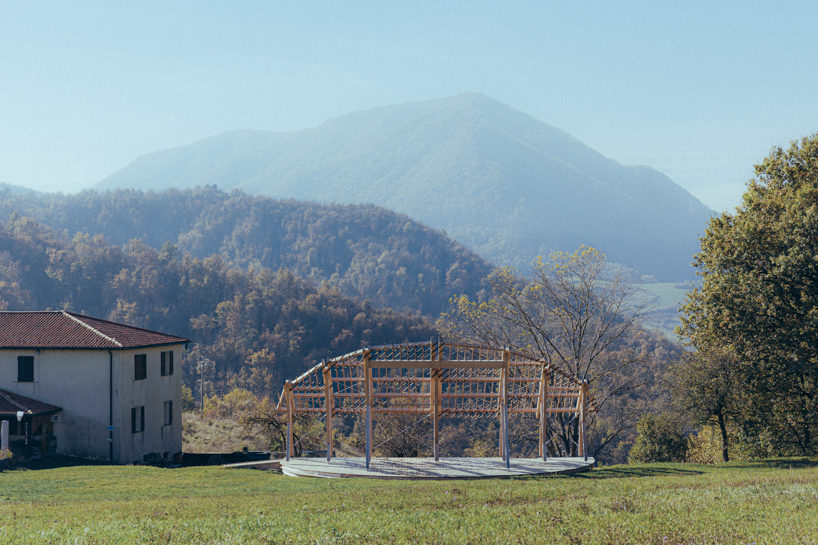 palcosole by grriz raises a half sun of timber above a historic park to gather community and light 1