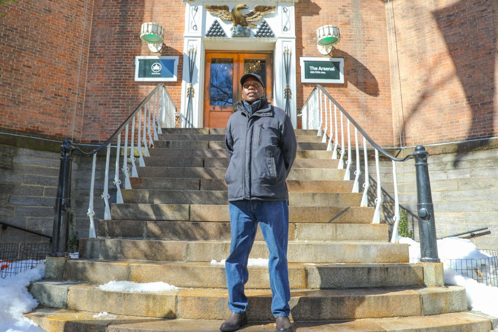 Photographer Malcolm Pinckney poses for a portrait in front The Arsenal in Central Park.