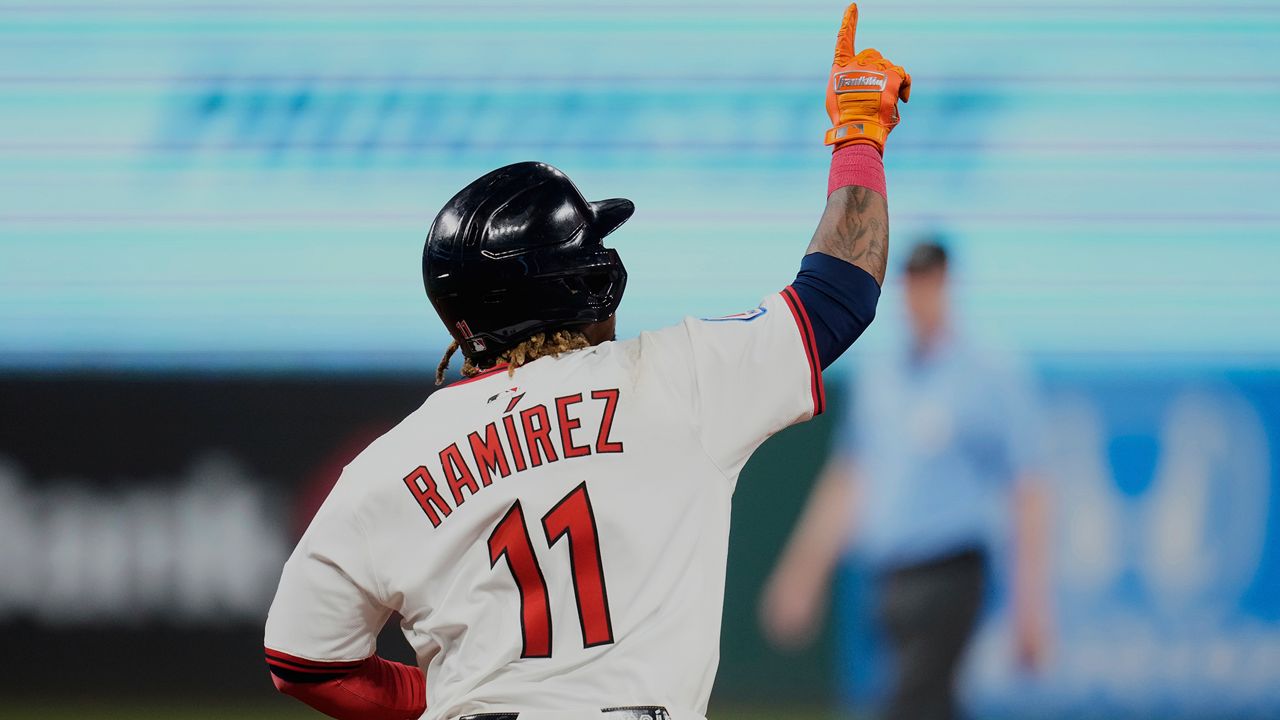 Cleveland Guardians' Jose Ramirez gestures as he runs the bases with a home run in the eighth inning of a baseball game against the Miami Marlins in Cleveland, Tuesday, Aug. 12, 2025. (AP Photo/Sue Ogrocki)