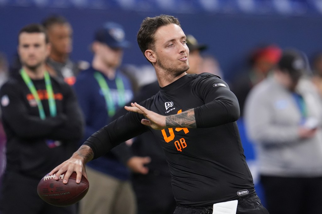 Miami quarterback Carson Beck (04) runs a drill at the NFL football scouting combine in Indianapolis.