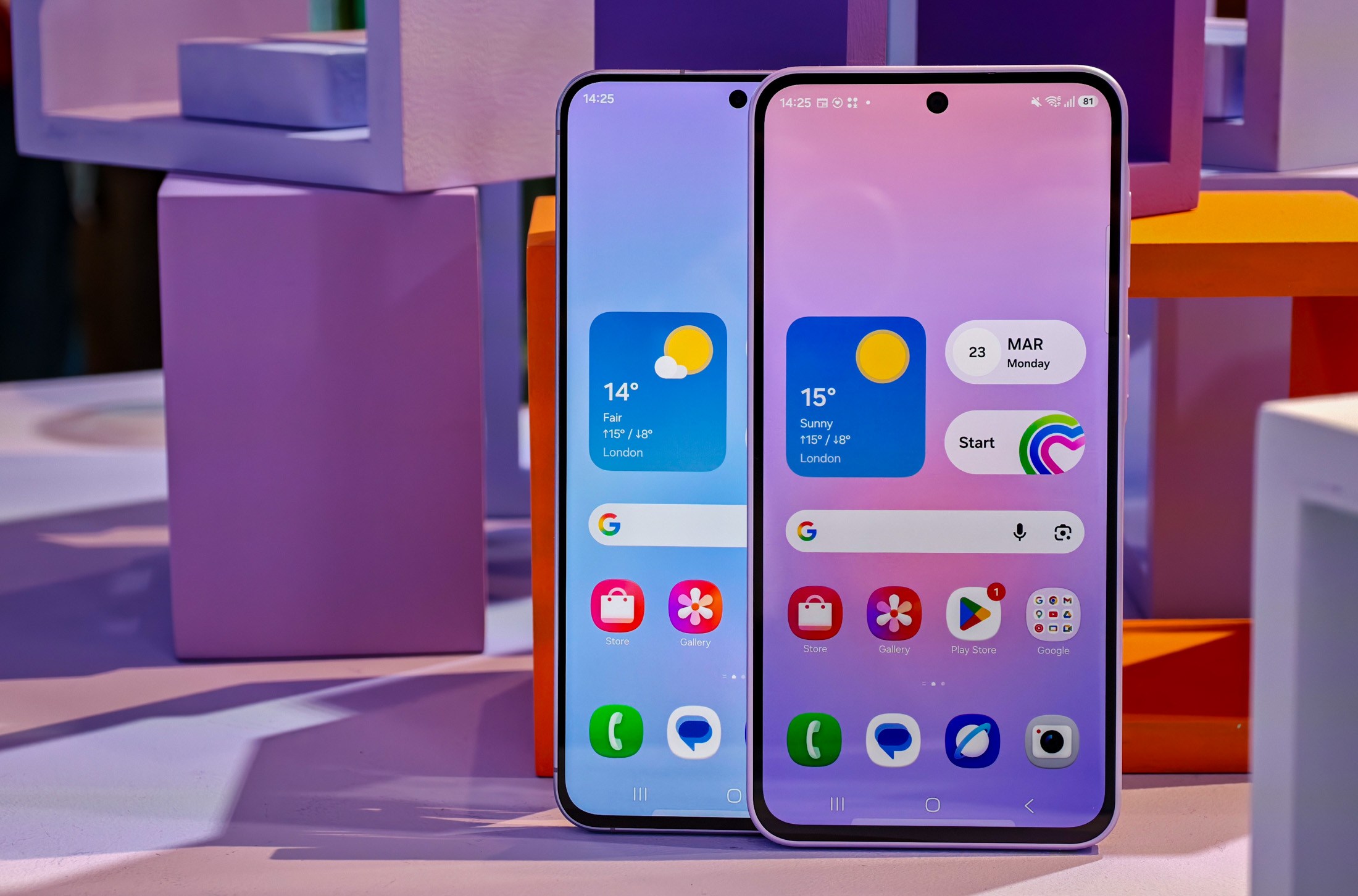 Samsung Galaxy A57 and A37 showing homescreens in front of colored cubes